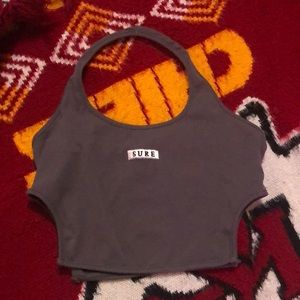 Crop top with logo “sure” on the front no rips/ tears in it, never worn!